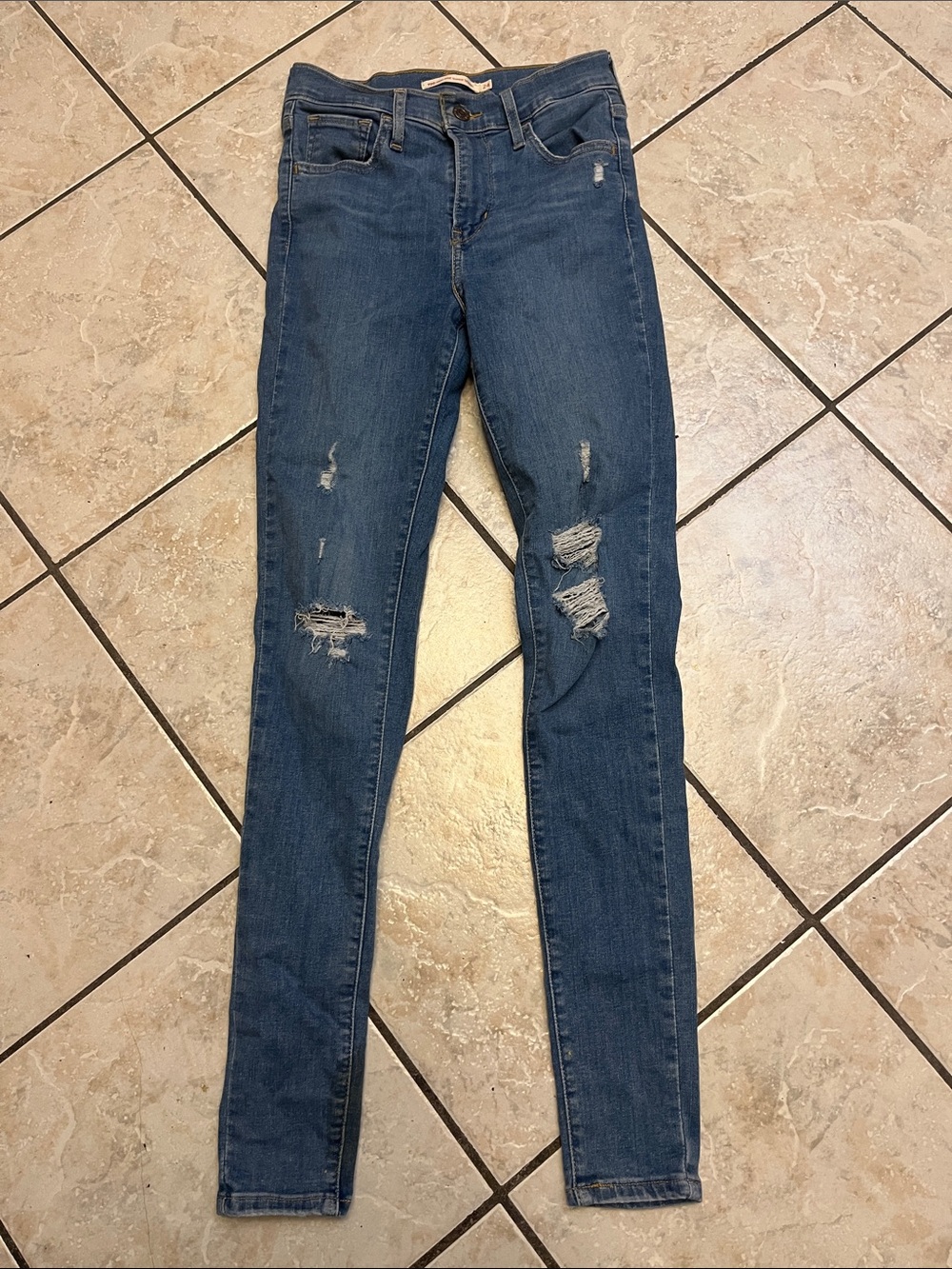 LEVIS’s Distressed high rise super skinny jeans 24